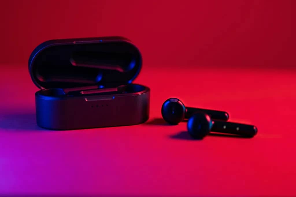 A pair of compact, wireless earbuds in a charging case